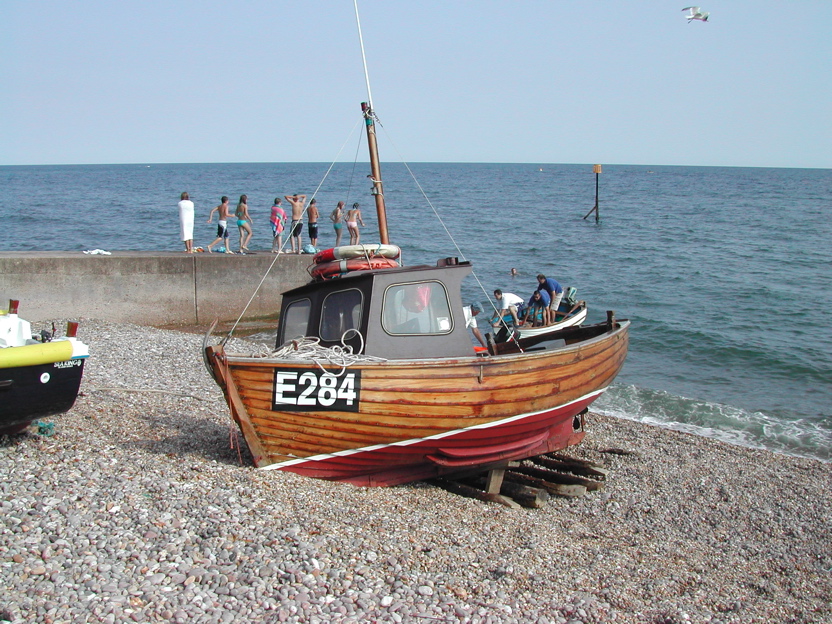 Small Wooden Fishing Boat Small wooden boat moored on